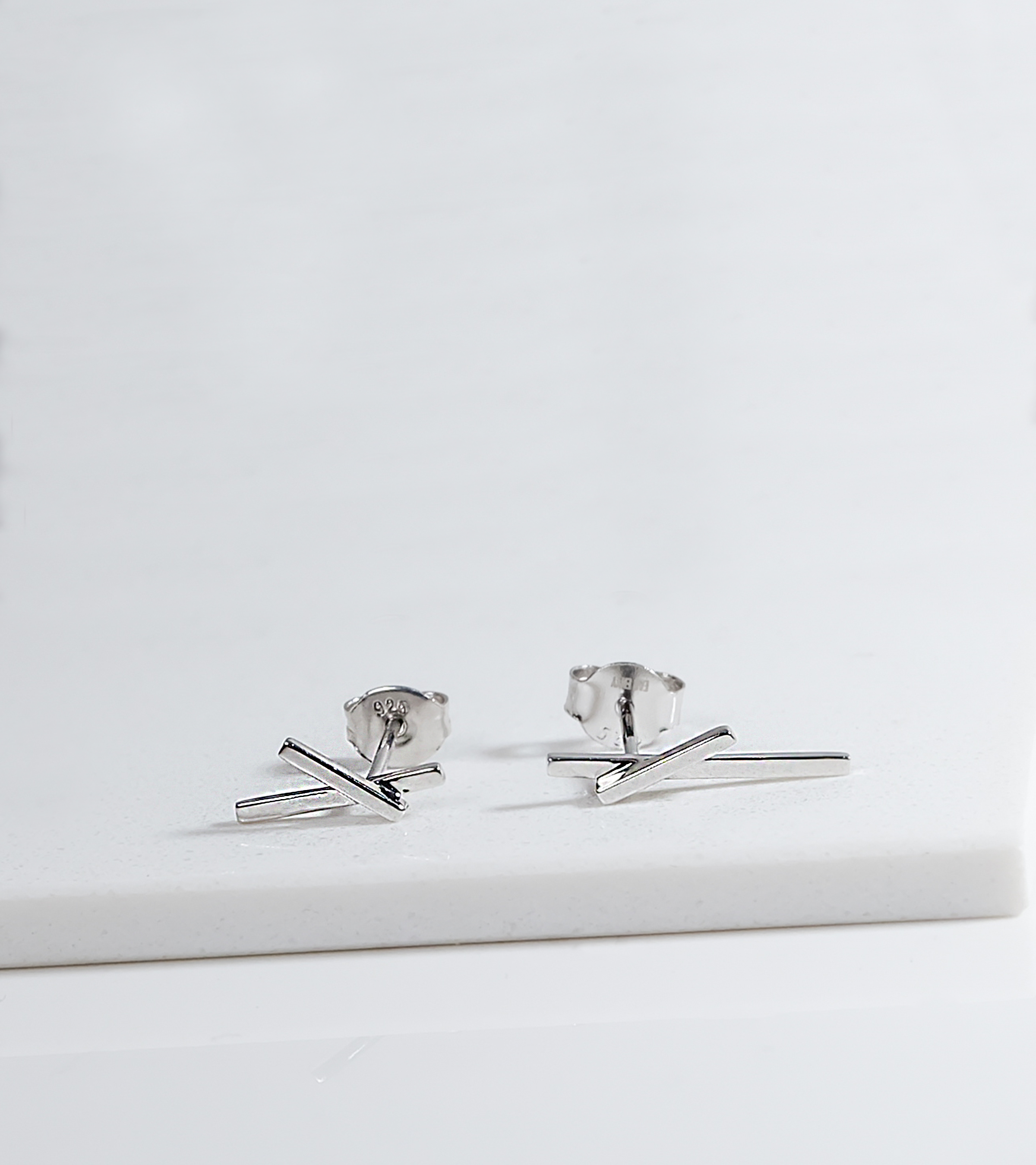 Sleek Silver Cross Earrings